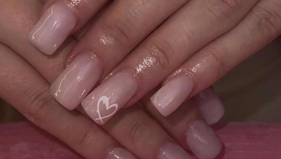 Elegant nude nails with heart accent at Beauty by Chloe🤍 in Edenbridge, England, GB.