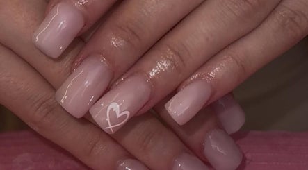 Elegant nude nails with heart accent at Beauty by Chloe🤍 in Edenbridge, England, GB.