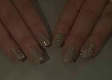 Sparkling nude manicure at Beauty by Chloe🤍, Edenbridge, England, GB. Elegant nail care with glitter accents.