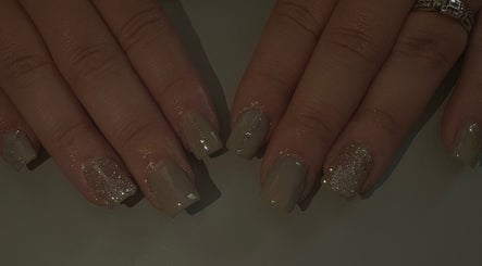 Sparkling nude manicure at Beauty by Chloe🤍, Edenbridge, England, GB. Elegant nail care with glitter accents.