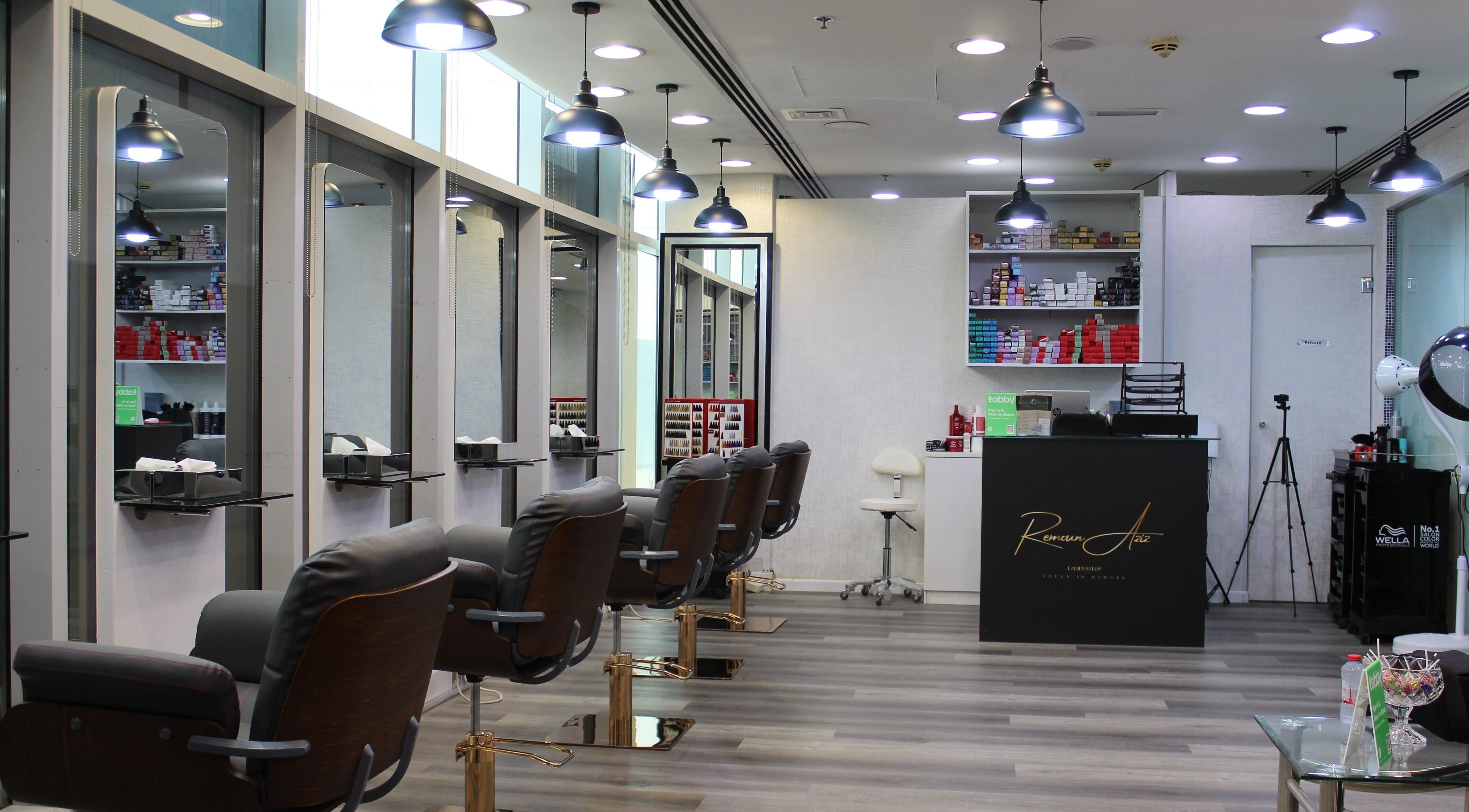 Modern interior of Remoun Aziz Ladies Salon in Dubai, Dubai, AE featuring elegant styling chairs and bright lighting.