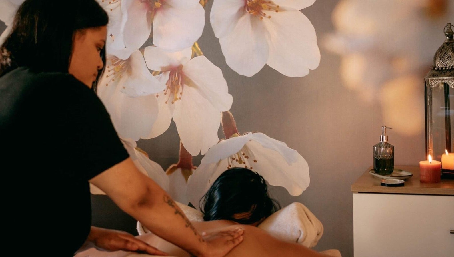 Relaxing massage at Tashreeqah Verrie Massage Studio, Gqeberha, Eastern Cape, ZA amidst floral decor.