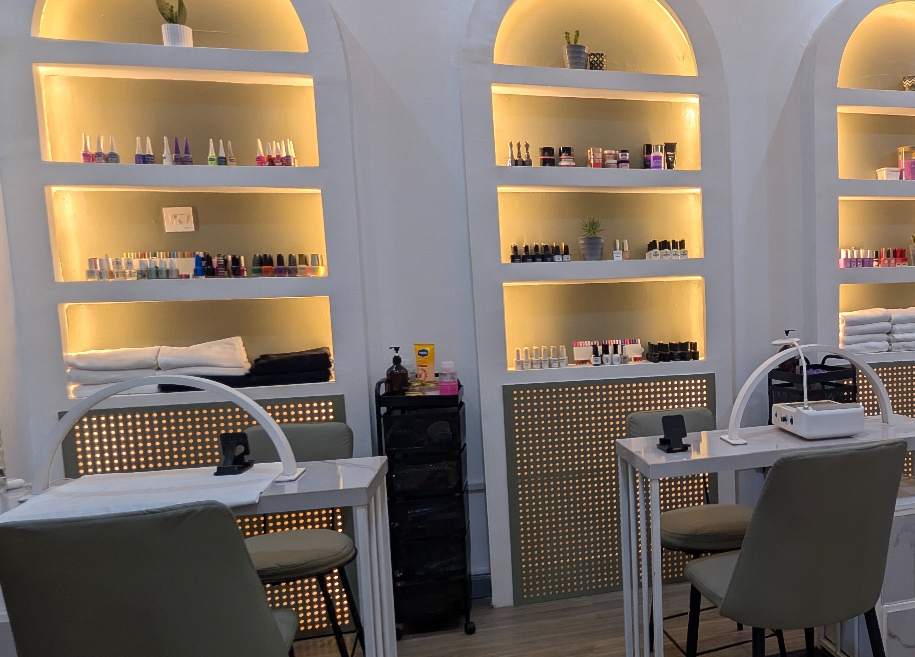 Chic nail studio at Nail Tech - Bugolobi, Kampala, Central Region, UG, showcasing organized nail polish displays.