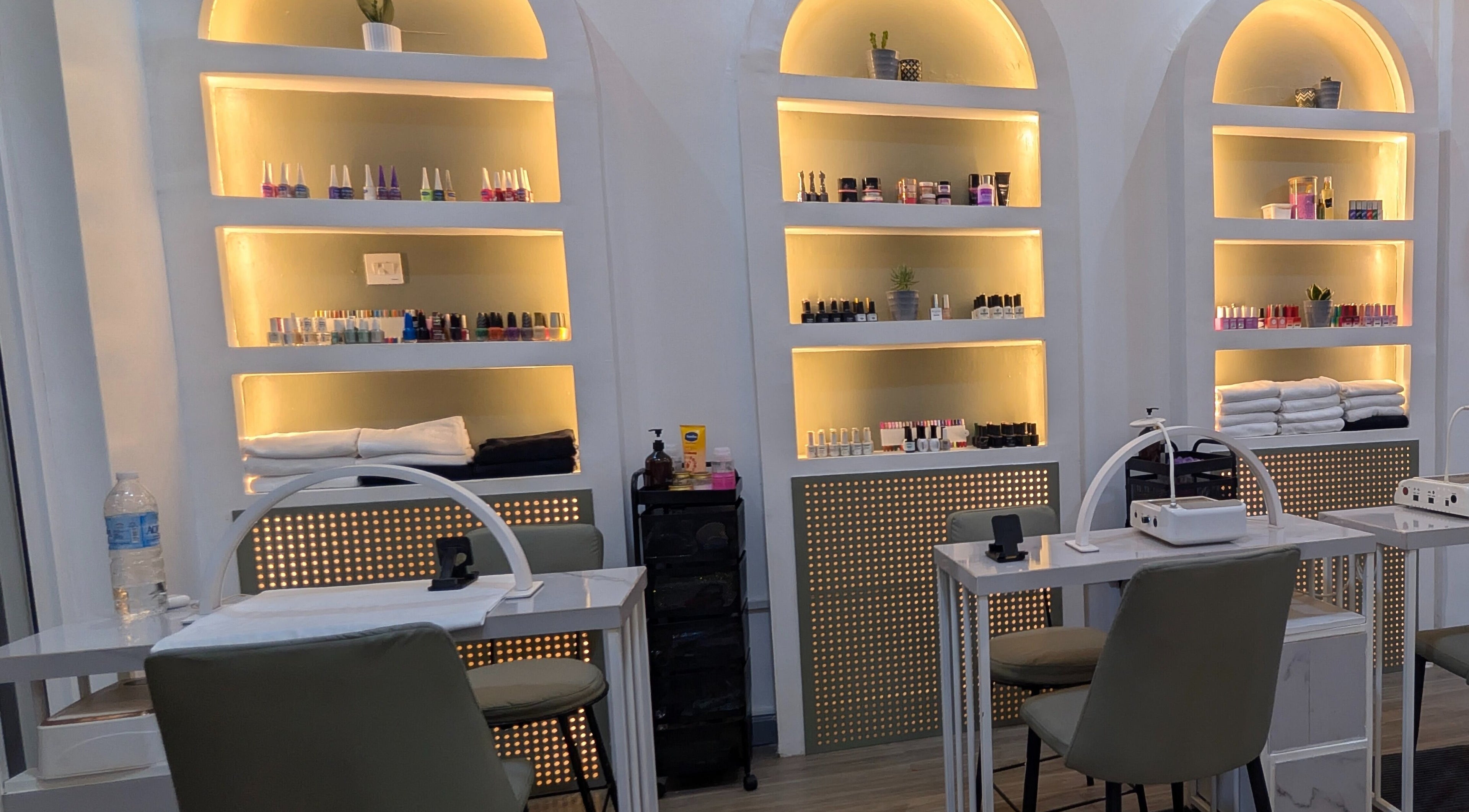 Chic nail studio at Nail Tech - Bugolobi, Kampala, Central Region, UG, showcasing organized nail polish displays.