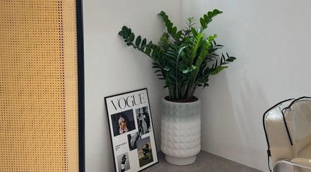 Elegant Mès Maison corner with potted plant and Vogue frame at Singapore, Singapore, SG.
