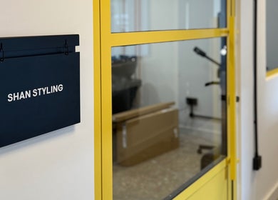 Entrance of Shanstyling in London, England, GB, featuring a modern black and yellow design.
