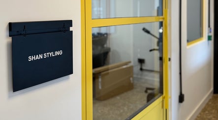 Entrance of Shanstyling in London, England, GB, featuring a modern black and yellow design.