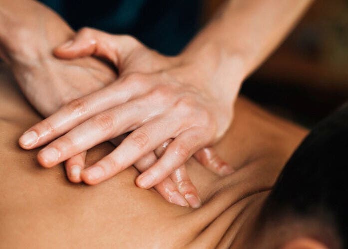 Relaxing back massage at Chokdee Thai Massage by Meaw in Perth, Scotland, GB, showcasing expert hand techniques.