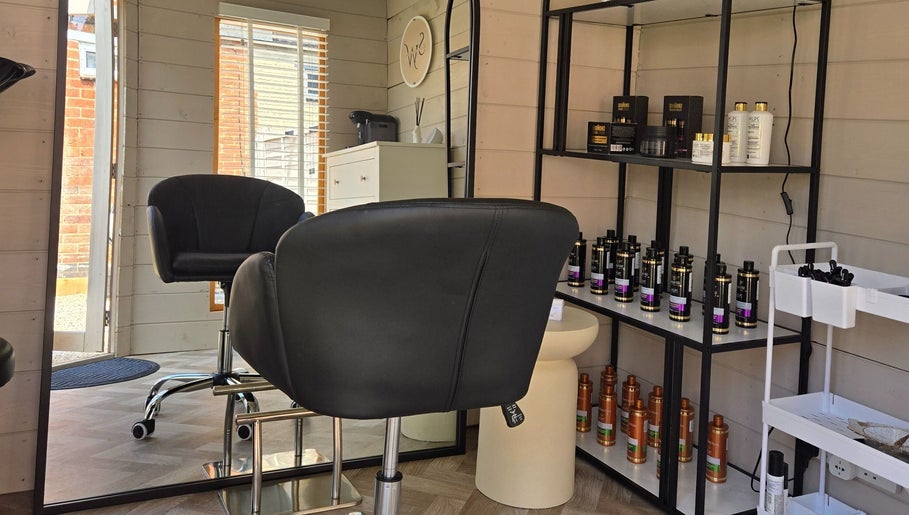 Stylish interior of Healthy Hair Studio Derby in Derby, England, GB with sleek chairs and premium hair products.