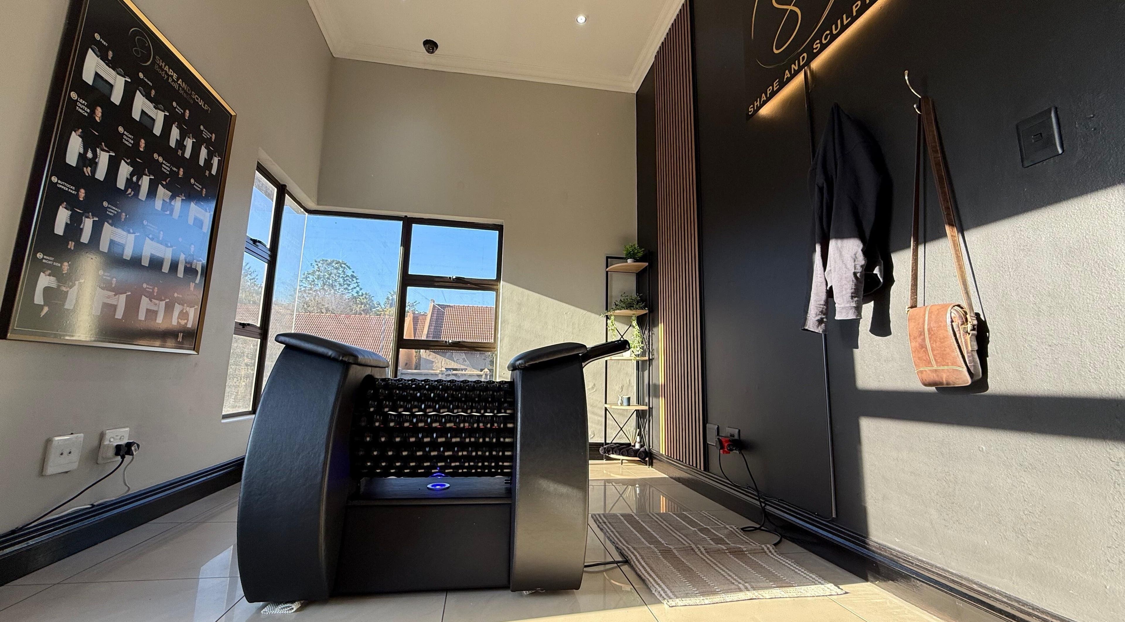 Modern wellness area at Shape And Sculpt in Pretoria, Gauteng, ZA with massage equipment and decor.