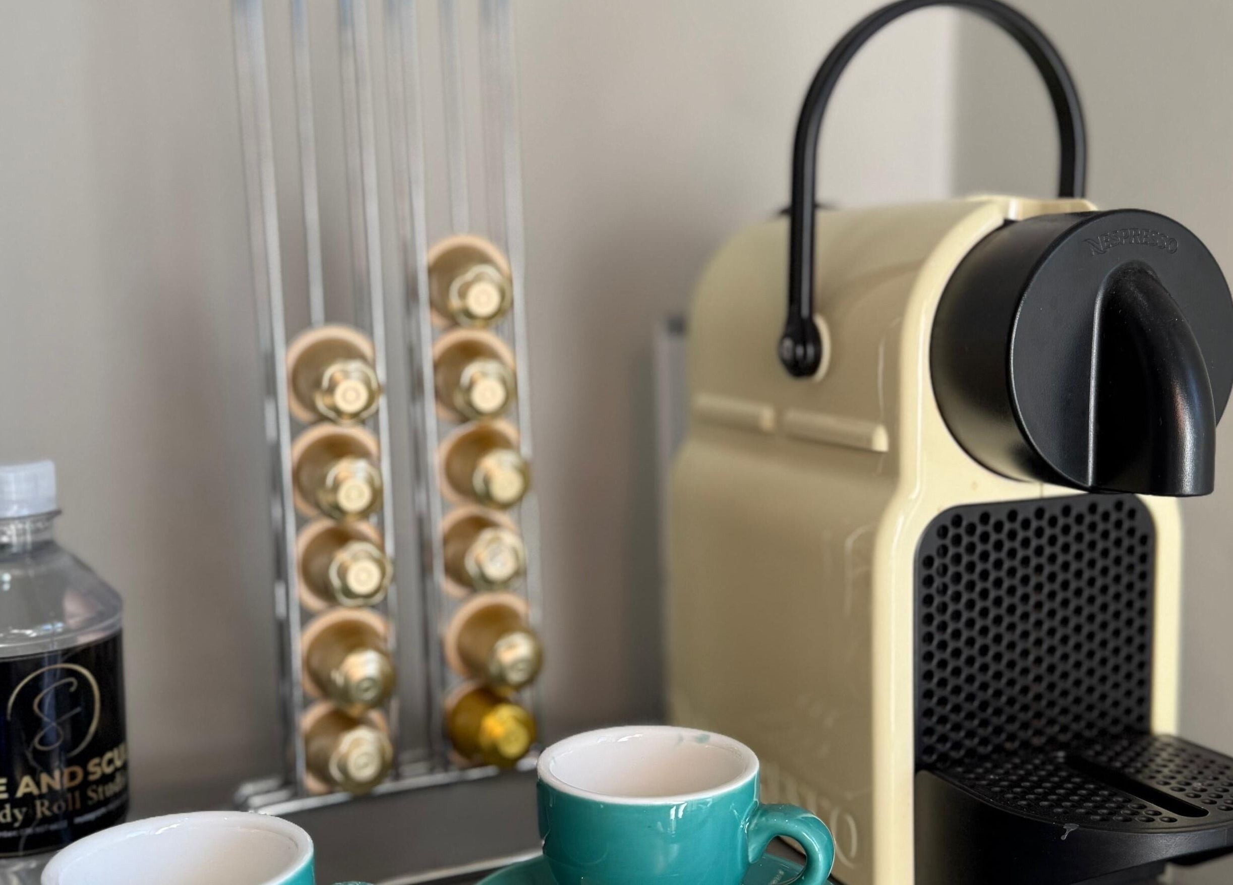 Coffee setup at Shape And Sculpt, Pretoria, Gauteng, ZA offers a comforting welcome with coffee and water.
