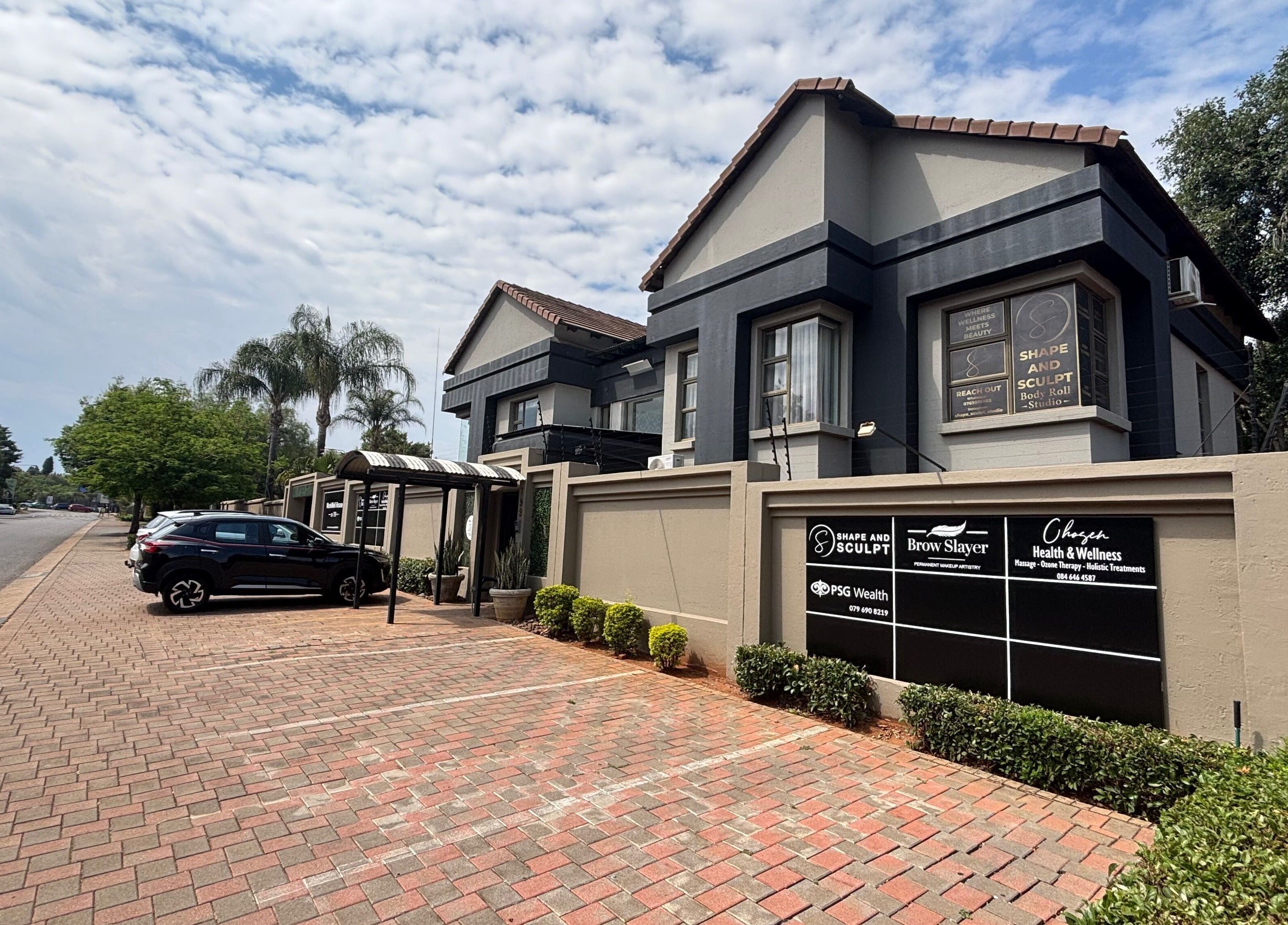 Exterior view of Shape And Sculpt in Pretoria, Gauteng, ZA, showcasing modern architecture and landscaped surroundings.
