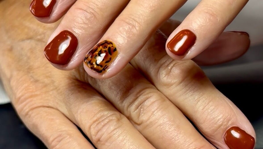 Stylish glossy and tiger pattern nails at Nails by Delle, Dingwall, Scotland, GB.