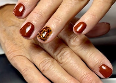 Stylish glossy and tiger pattern nails at Nails by Delle, Dingwall, Scotland, GB.