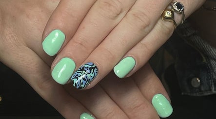 Close-up of mint and blue patterned nails by Nails by Delle, Dingwall, Scotland, GB.