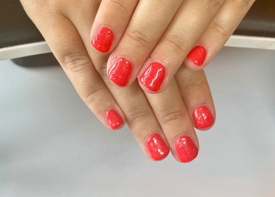 Red gel manicure at Nails by Delle in Dingwall, Scotland, GB showcasing vibrant nail artistry.