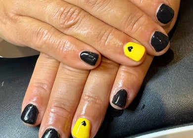 Black and yellow nail art with hearts at Nails by Delle, Dingwall, Scotland, GB.