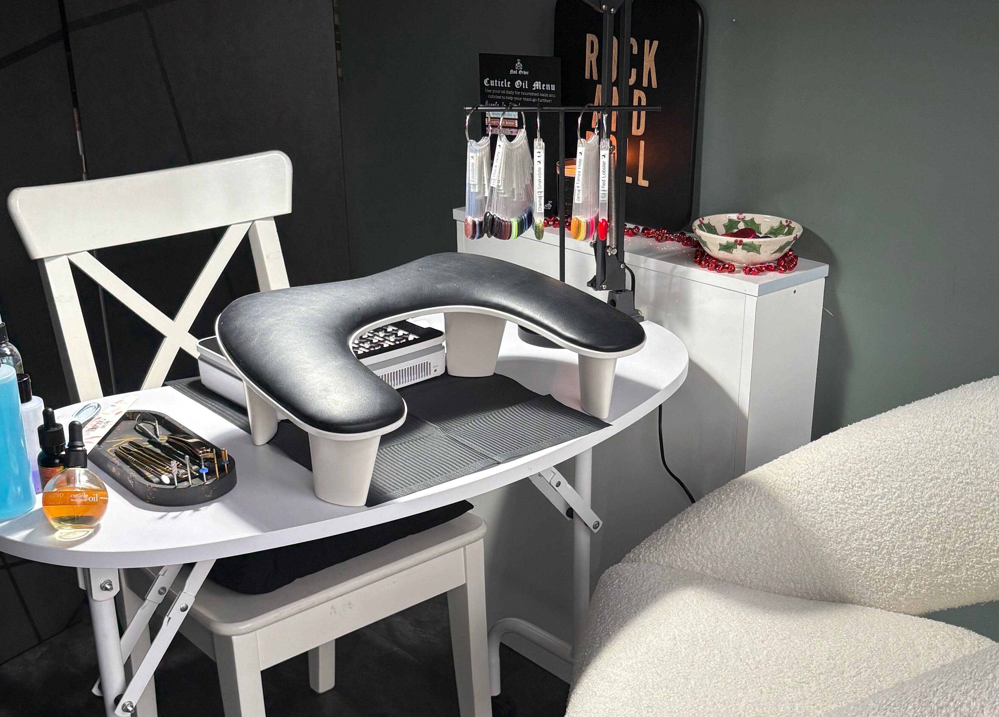 Stylish nail station at Nails by Delle in Dingwall, Scotland, GB, featuring tools and products for manicures.