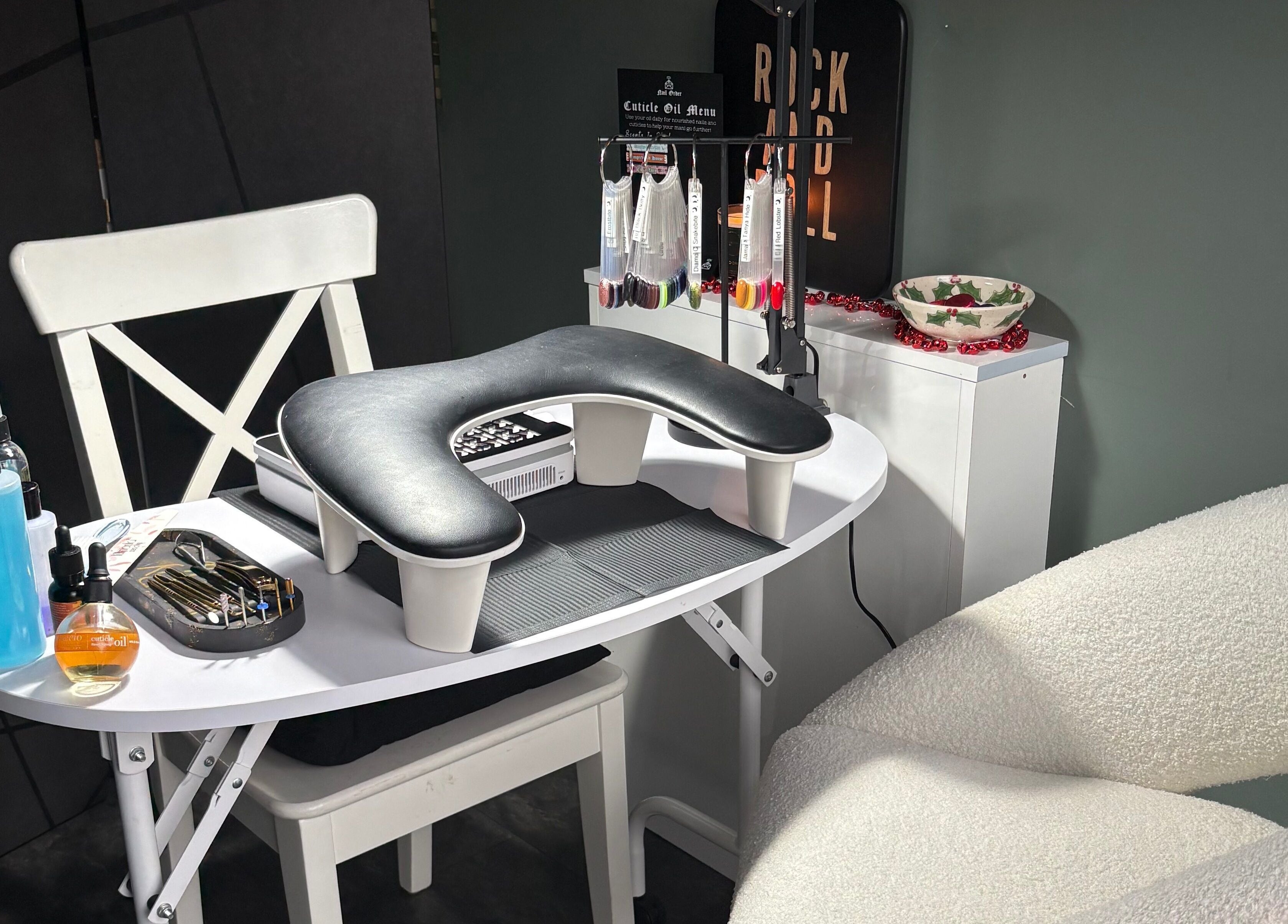 Stylish nail station at Nails by Delle in Dingwall, Scotland, GB, featuring tools and products for manicures.