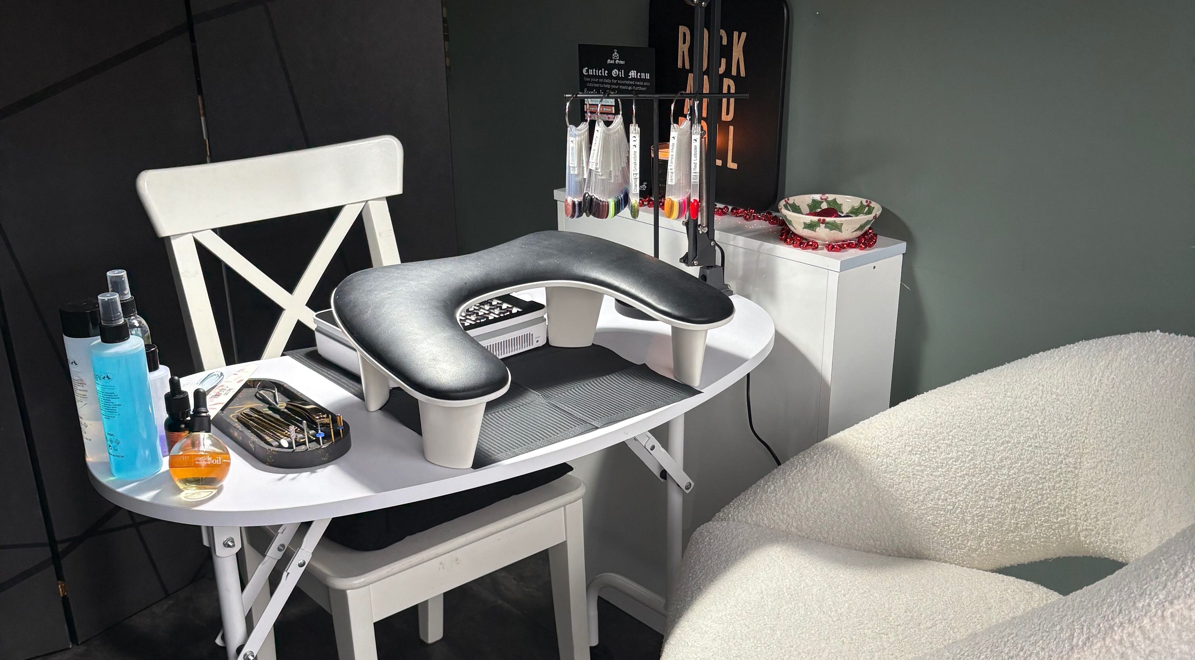 Stylish nail station at Nails by Delle in Dingwall, Scotland, GB, featuring tools and products for manicures.