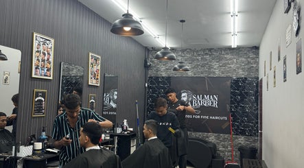 Stylish interior of Salman Barber in Seri Kembangan, Selangor, MY, featuring professional barbers at work.