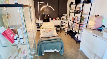 Relaxing treatment room at Laura May's Beauty, Joondalup, Western Australia, AU, featuring a cozy bed and products.