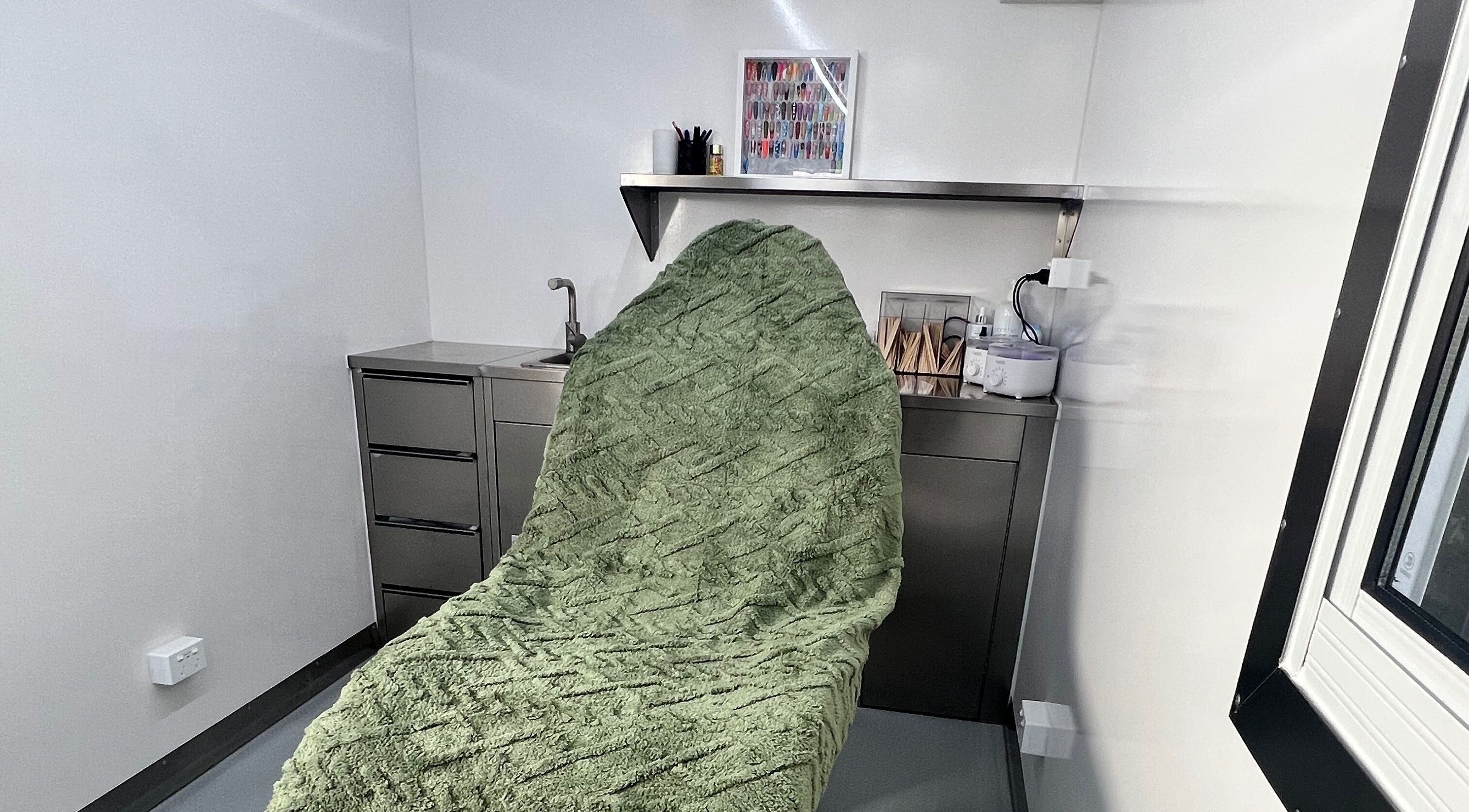 Cozy treatment room at Acryluxe Nails and Beauty, Dubbo, New South Wales, AU with plush green blanket.