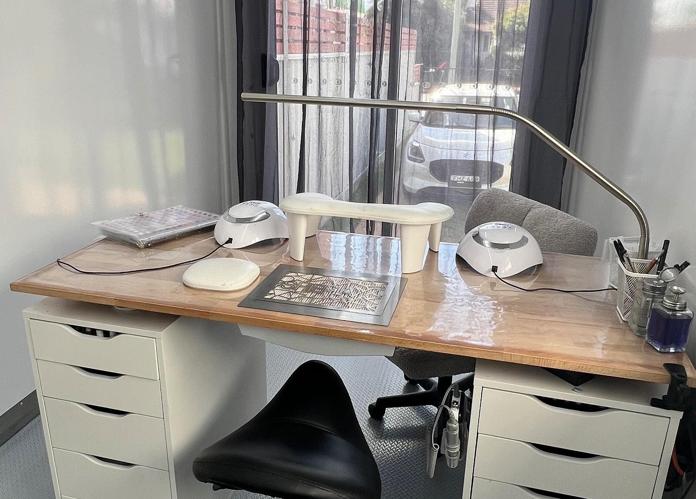 Manicure station at Acryluxe Nails and Beauty in Dubbo, New South Wales, AU, featuring modern equipment.