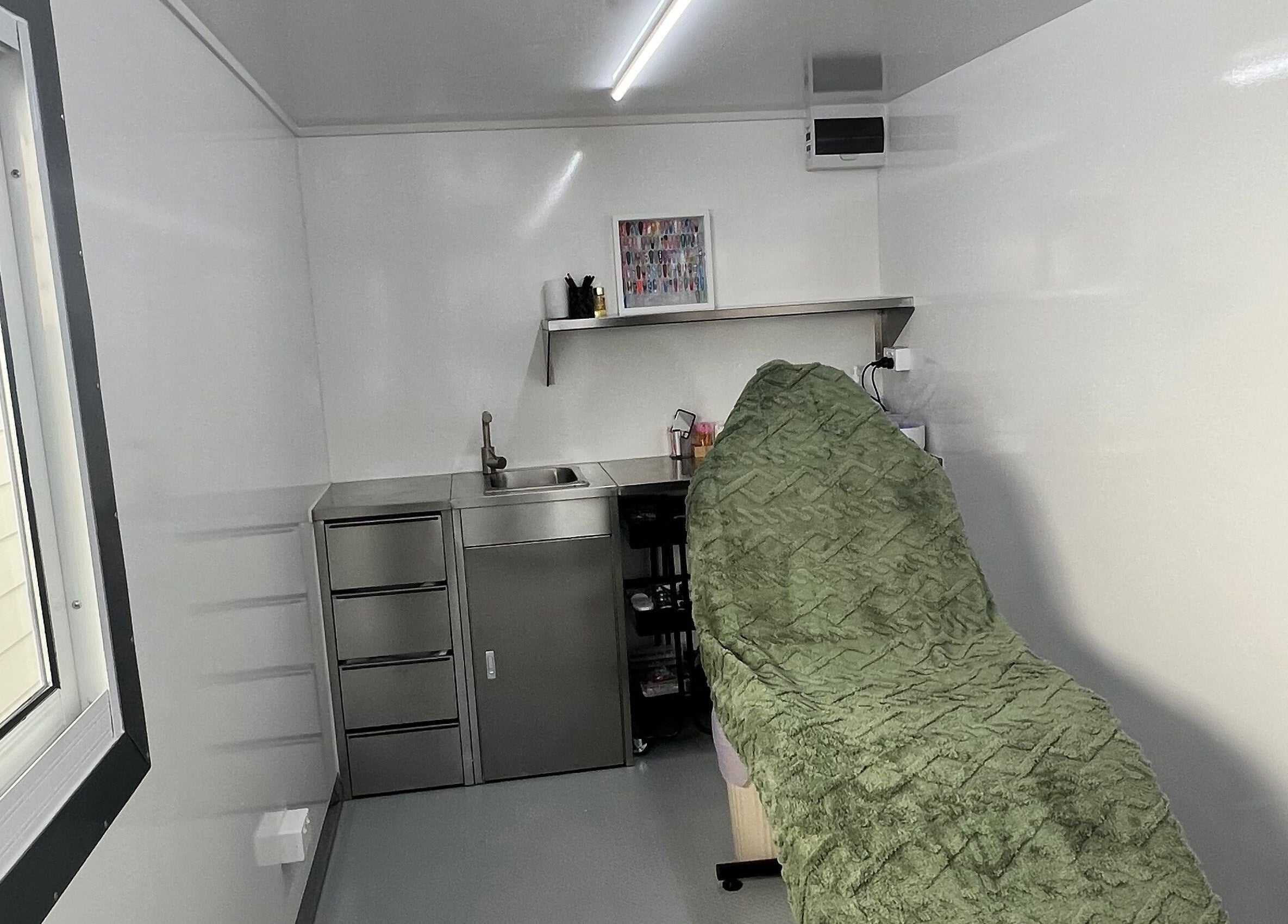 Relaxing treatment room at Acryluxe Nails and Beauty in Dubbo, New South Wales, AU, featuring a cozy blanket.