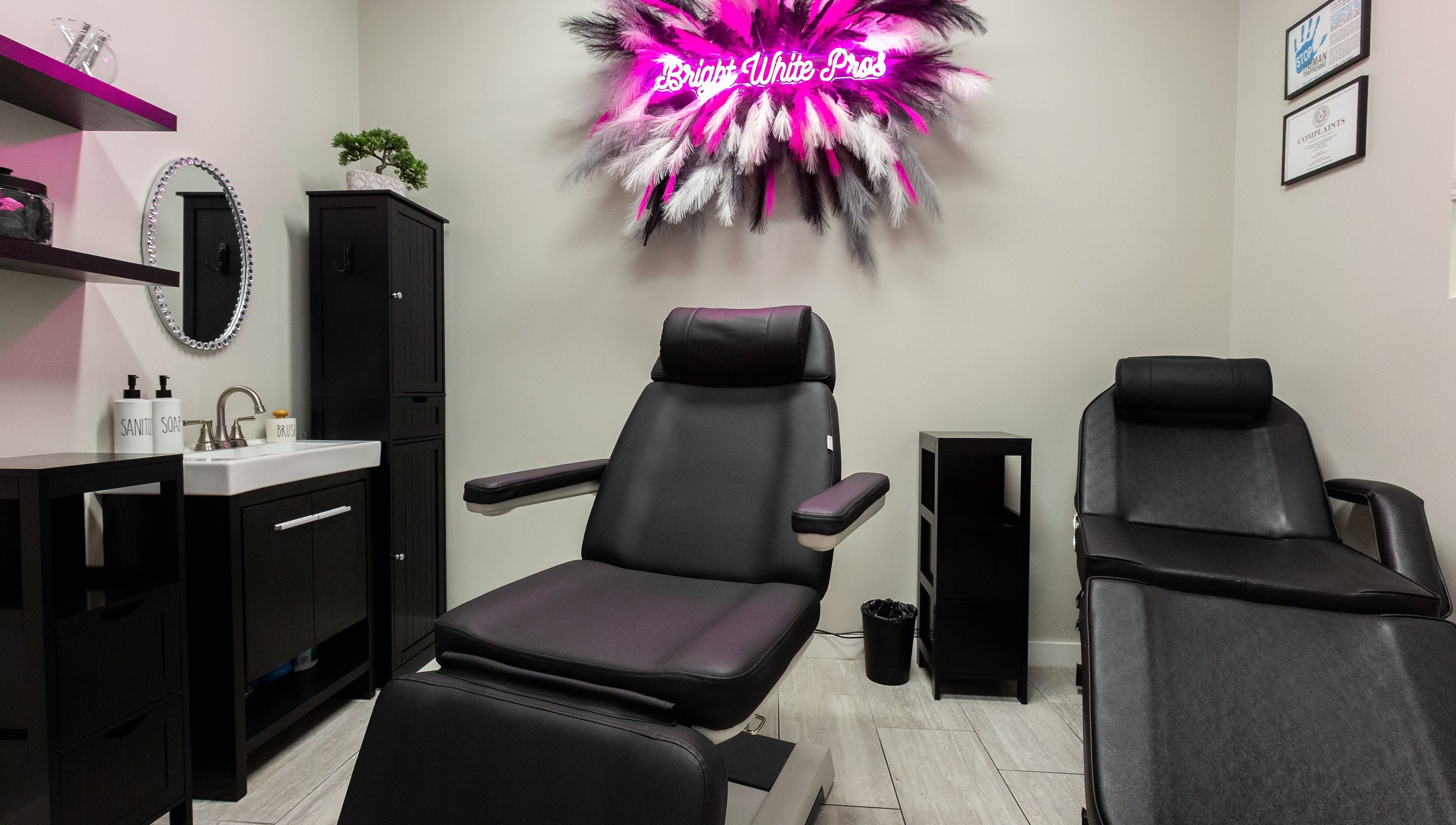 Bright White Pros beauty room with stylish black chairs in Fort Worth, Texas, US.