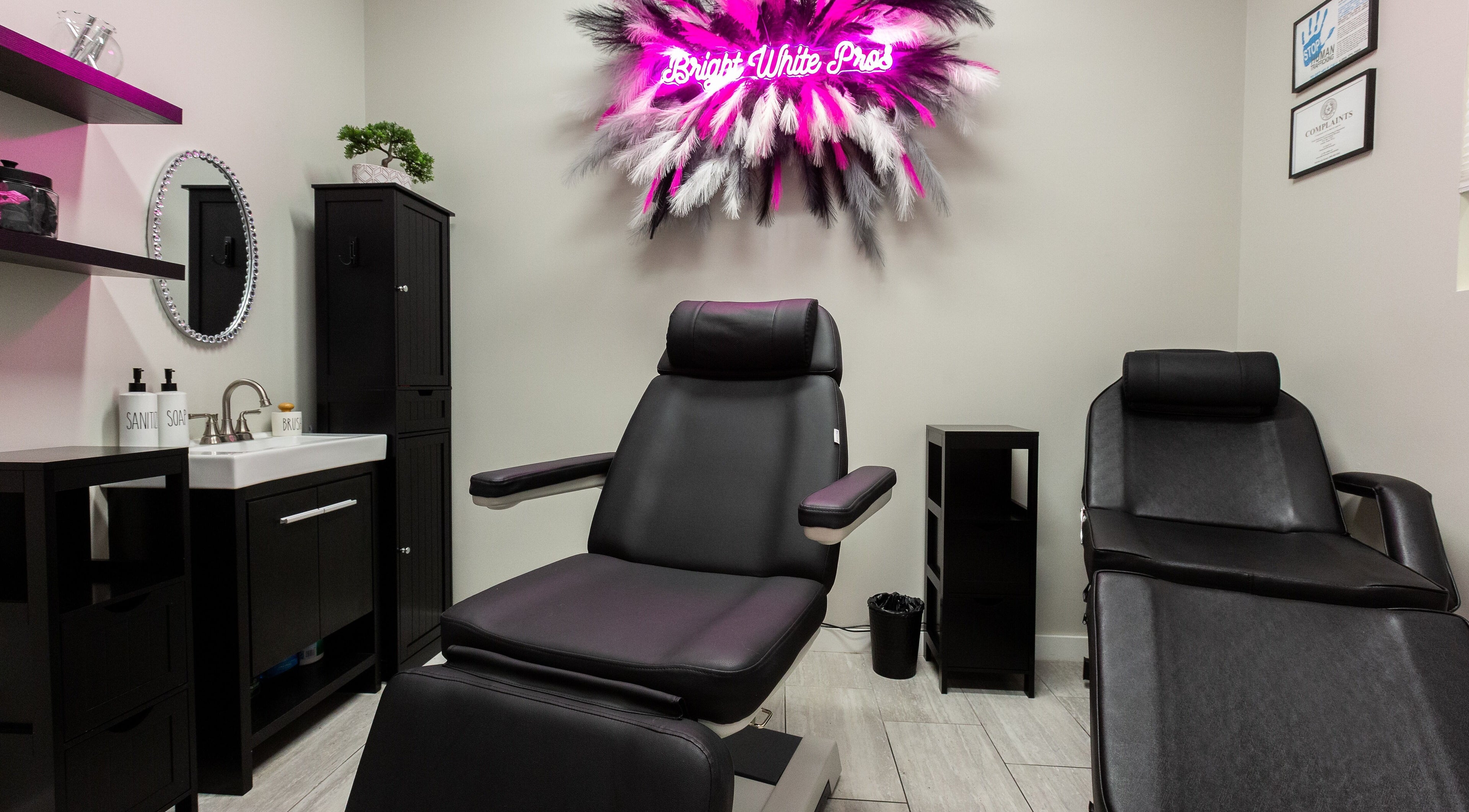 Bright White Pros beauty room with stylish black chairs in Fort Worth, Texas, US.
