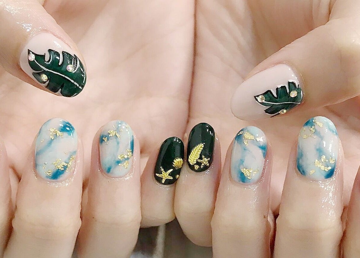 Elegant nail art featuring leaf designs at Twenty Nails, Singapore, Singapore, SG.