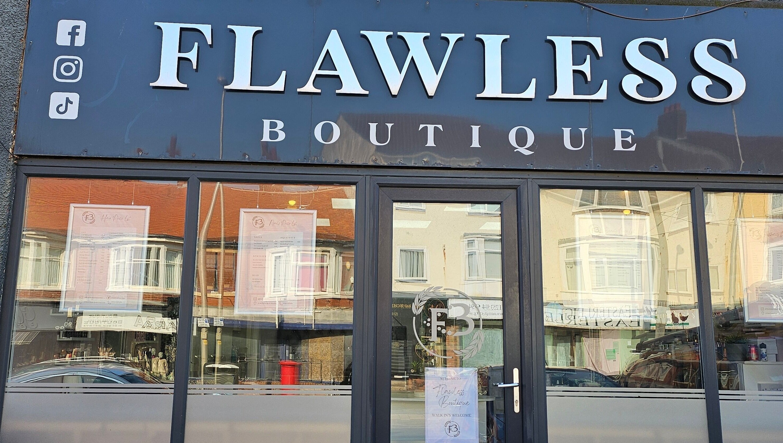 Front view of Flawless Boutique Bispham, Blackpool, England, GB, showcasing elegant signage and glass entrance.