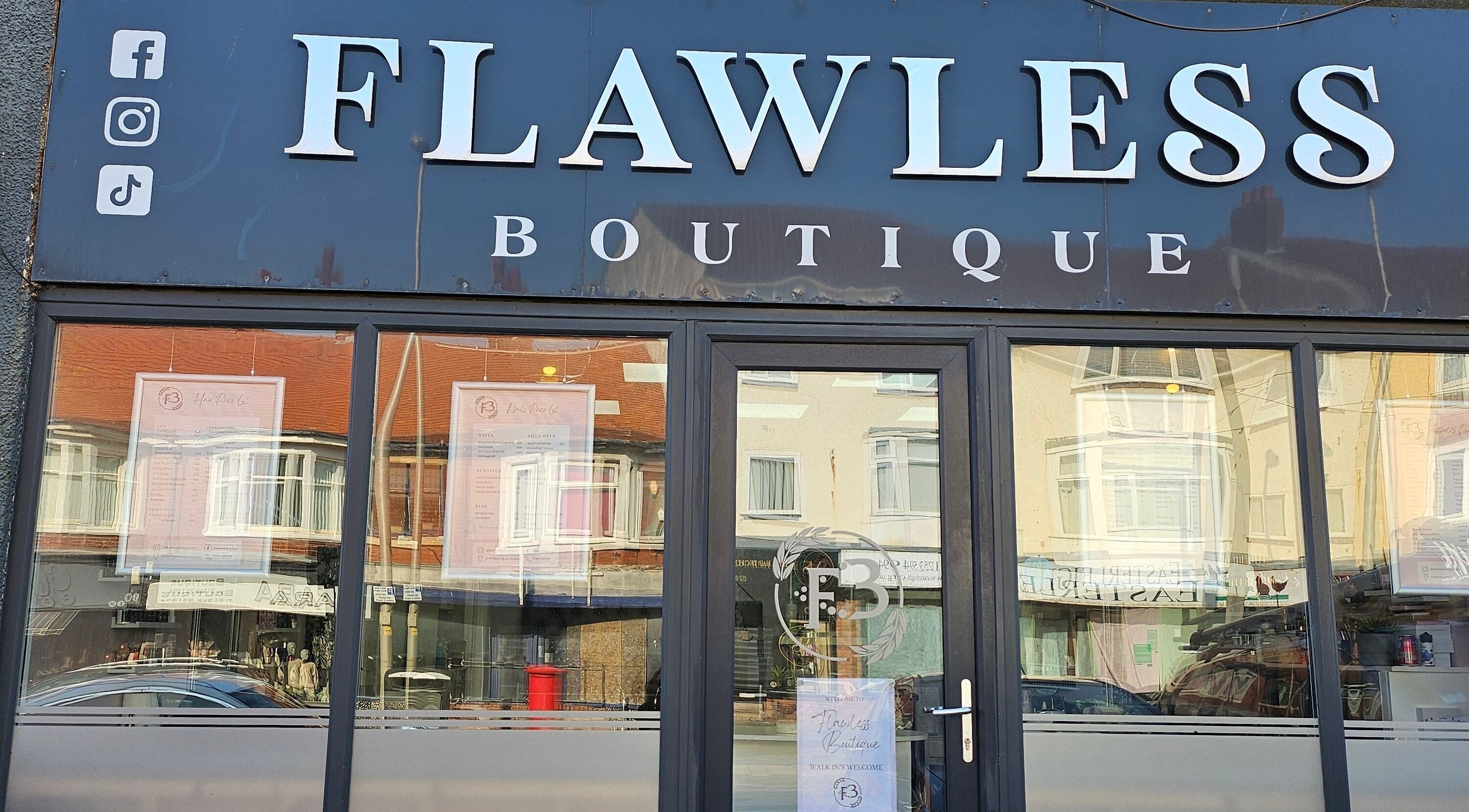 Front view of Flawless Boutique Bispham, Blackpool, England, GB, showcasing elegant signage and glass entrance.