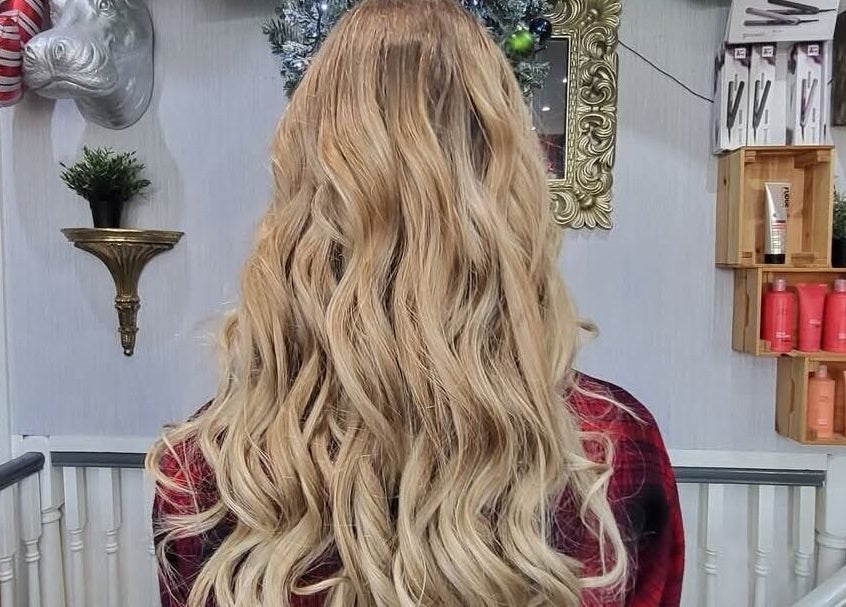 Elegant blonde waves styled at Flawless Boutique Bispham, Blackpool, England, GB; a luxurious beauty experience.