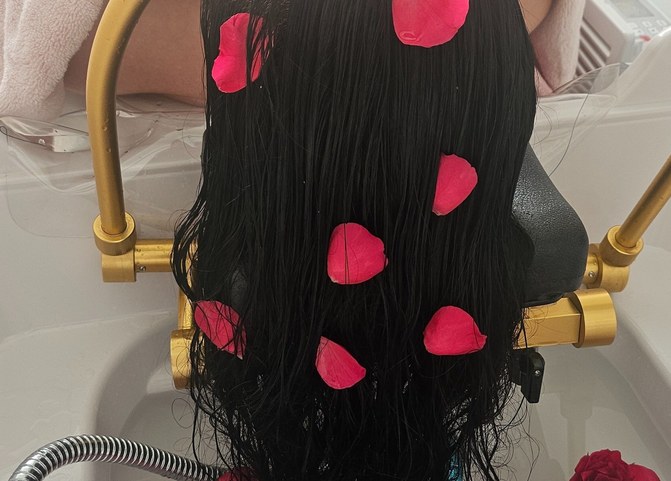 Luxurious hair wash with rose petals at Flawless Boutique Bispham, Blackpool, England, GB.