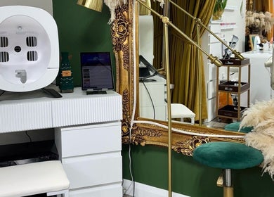 Luxurious beauty station at A&S Hair and Beauty Salon, London, England, GB with ornate mirror and plush seating.
