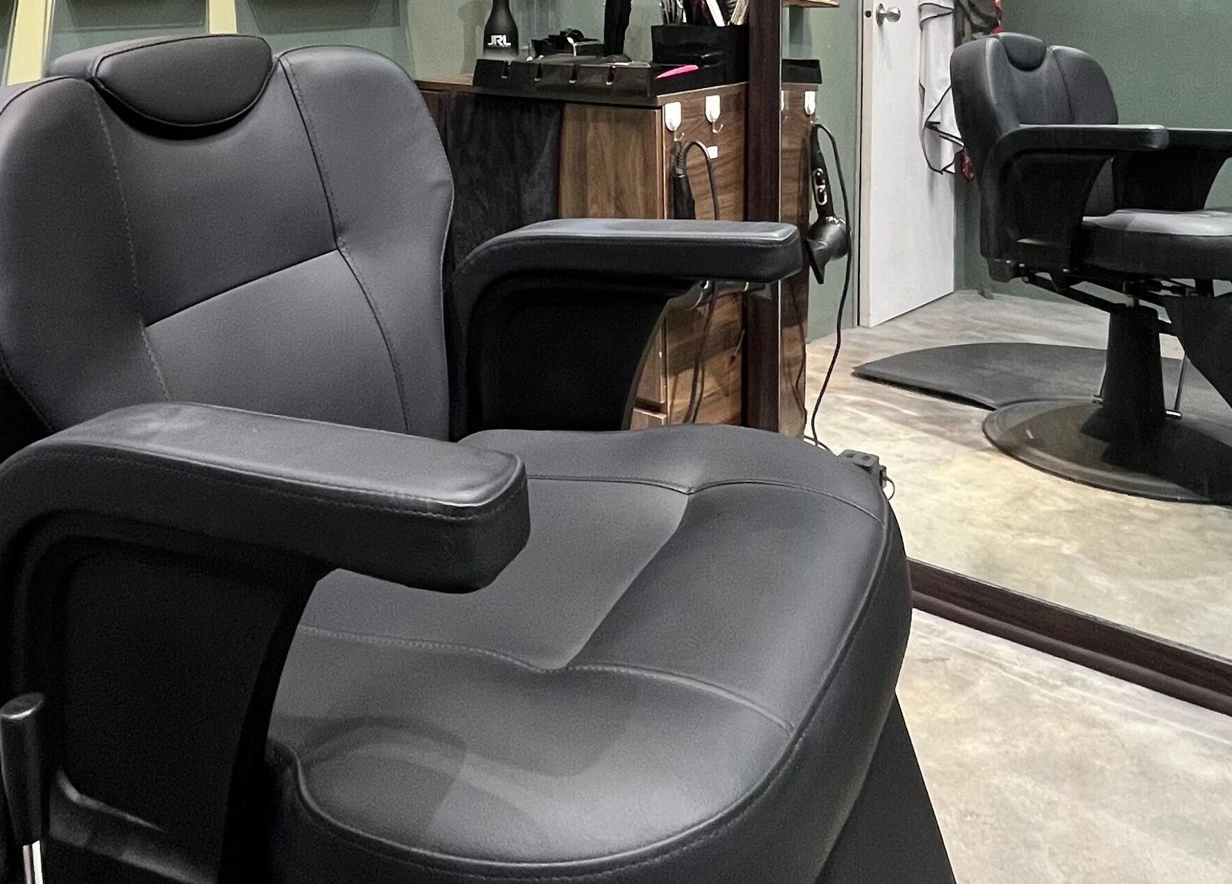 Stylish barber chair at Ayos Barbershop, Batu Caves, Selangor, MY. Modern comfort and elegance.