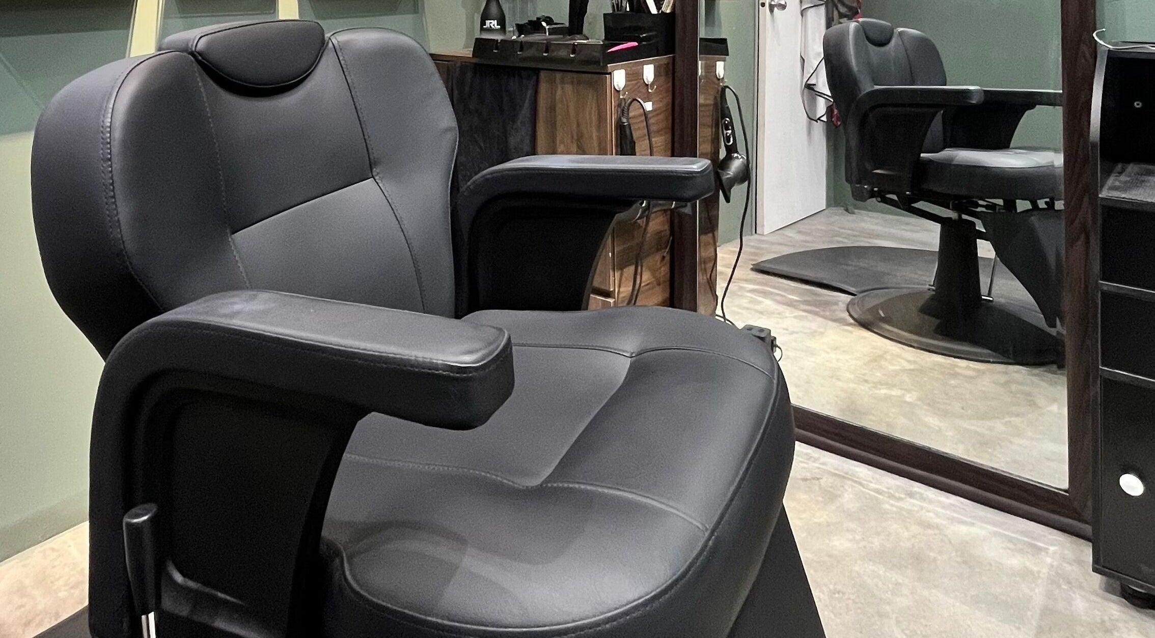 Stylish barber chair at Ayos Barbershop, Batu Caves, Selangor, MY. Modern comfort and elegance.