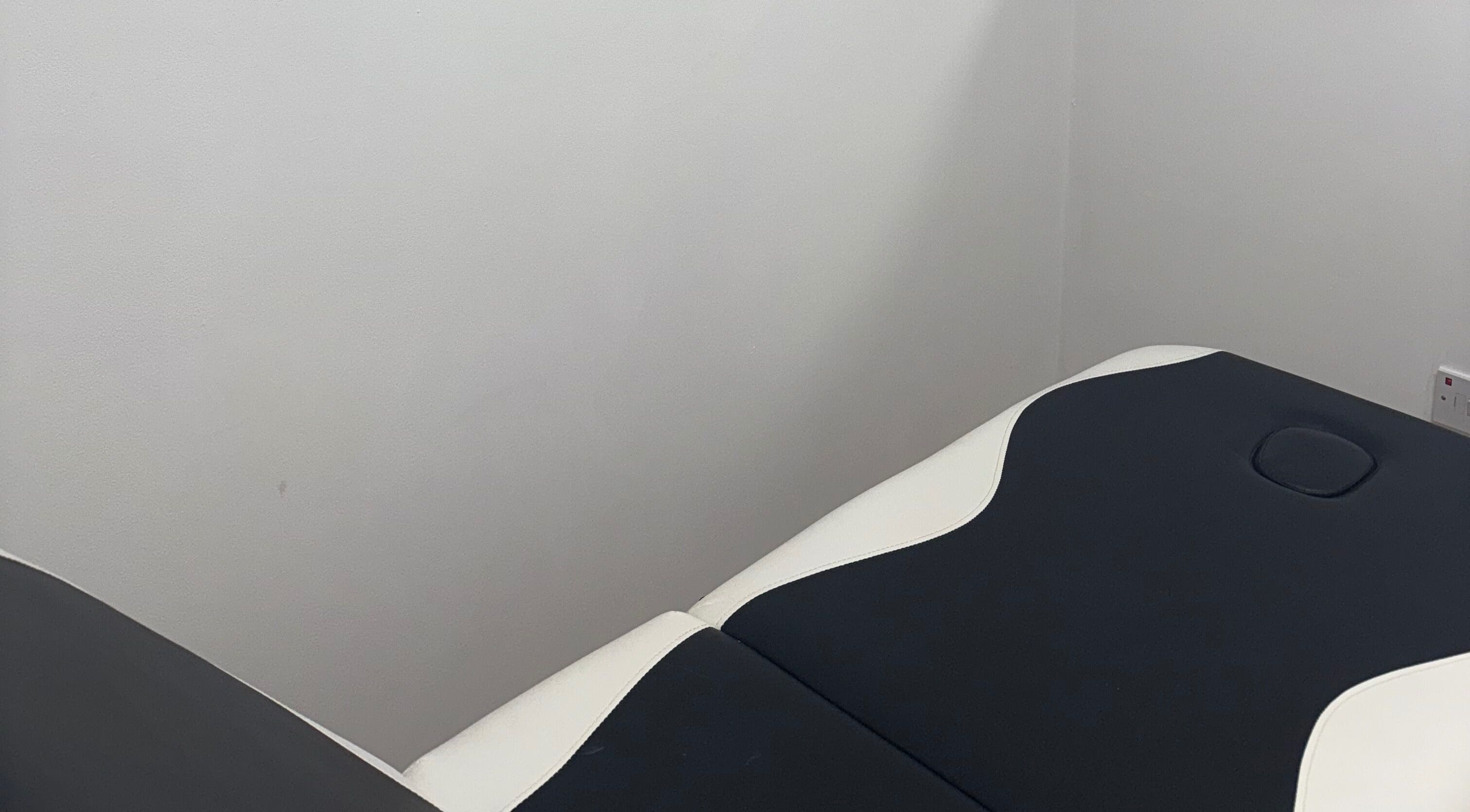 Massage table at Nu Faces by Georgina in Wakefield, England, GB, ready for spa treatments in a tranquil setting.