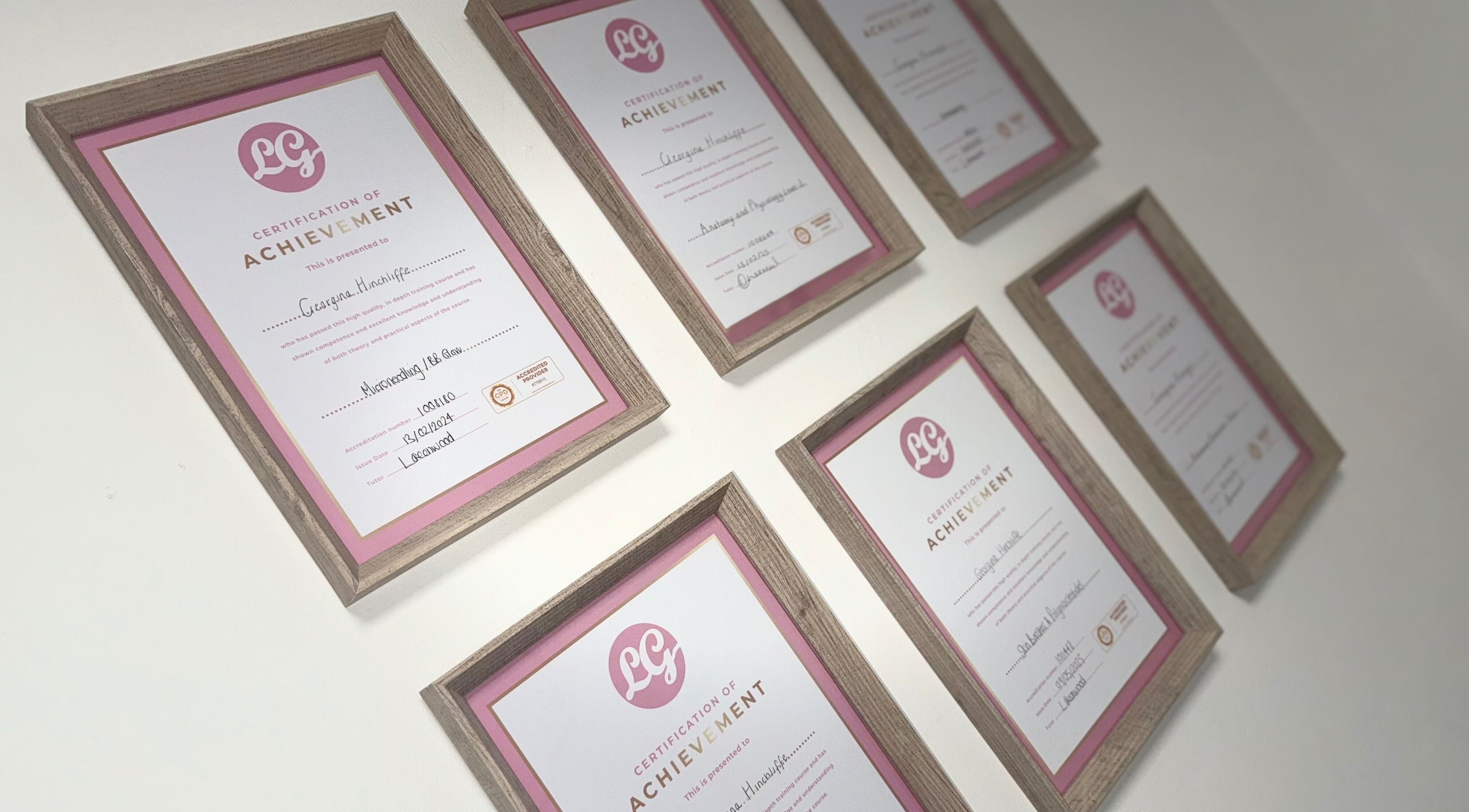Framed certificates on the wall at Nu Faces by Georgina, Wakefield, England, GB, showcasing accomplishments.