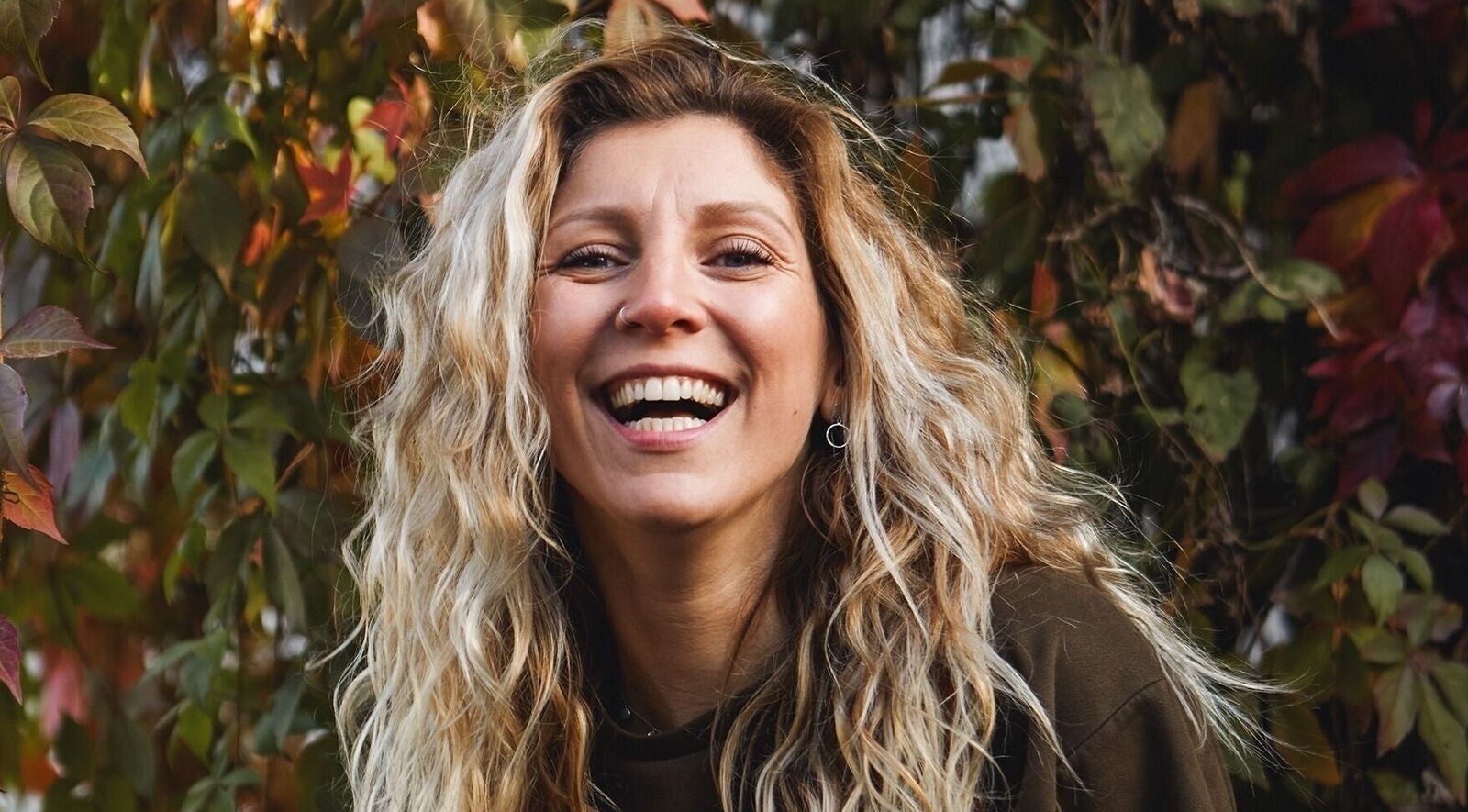 Smiling woman enjoying nature at Liz's Mobile Massage Canterbury, Canterbury, England, GB.