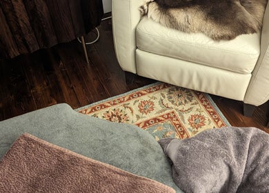 Relaxing massage setting at Liz's Mobile Massage Faversham, featuring plush towels and chair, Faversham, England, GB.