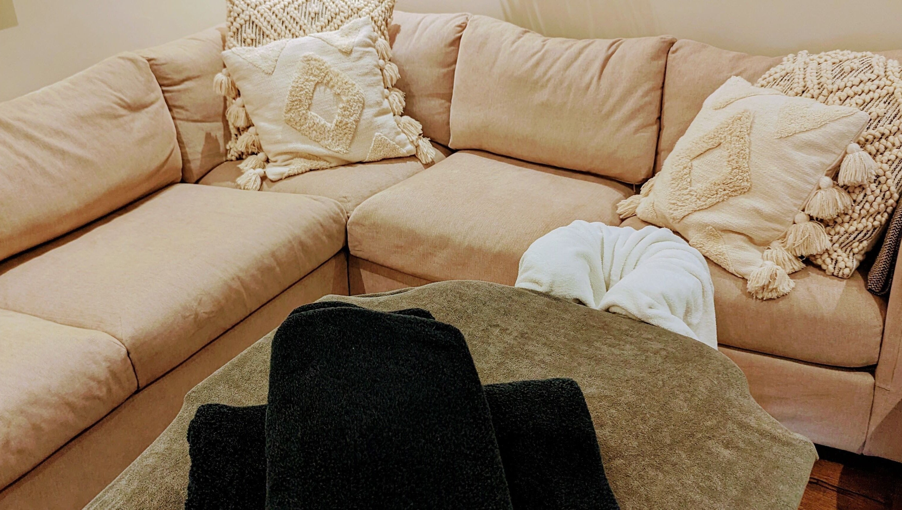 Inviting massage setup at Liz's Mobile Massage Faversham, featuring beige sofa with plush cushions, Faversham, England, GB.