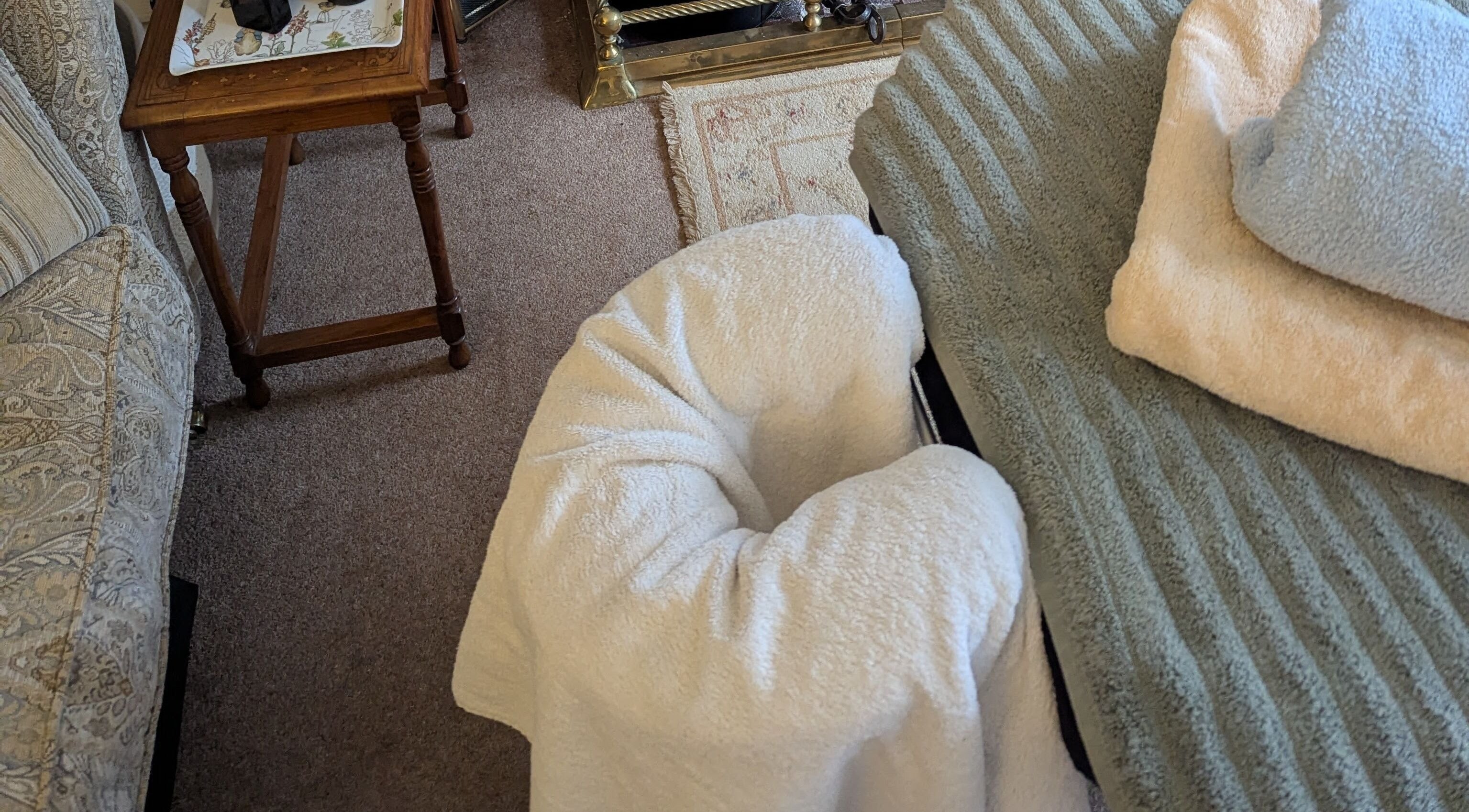 Massage table setup at Liz's Mobile Massage Faversham, Faversham, England, GB with cozy sheets.
