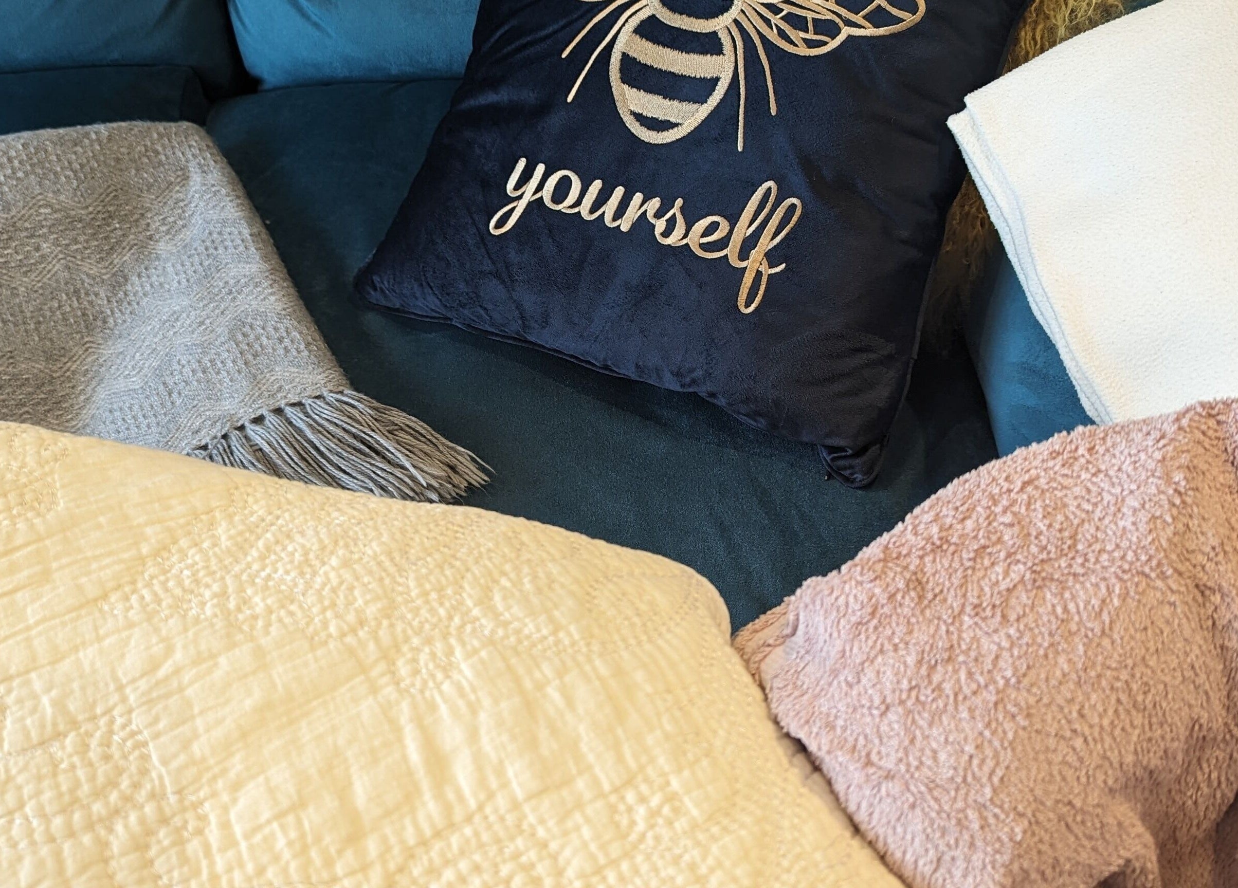 Plush cushions and throws at Liz's Mobile Massage Faversham create a cozy ambiance in Faversham, England, GB.