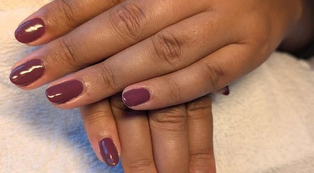 Elegant purple manicure from Agi Nails, Bulwark, Wales, GB, showcasing glossy finish on well-groomed nails.
