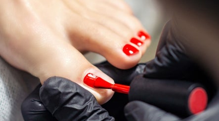Expert pedicure with red polish at Agi Nails, Bulwark, Wales, GB, showcasing professional nail care.