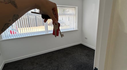 Spacious room at MelissaMcC.Beauty Clydebank, Scotland, GB, showcasing bright sunlight through large windows.