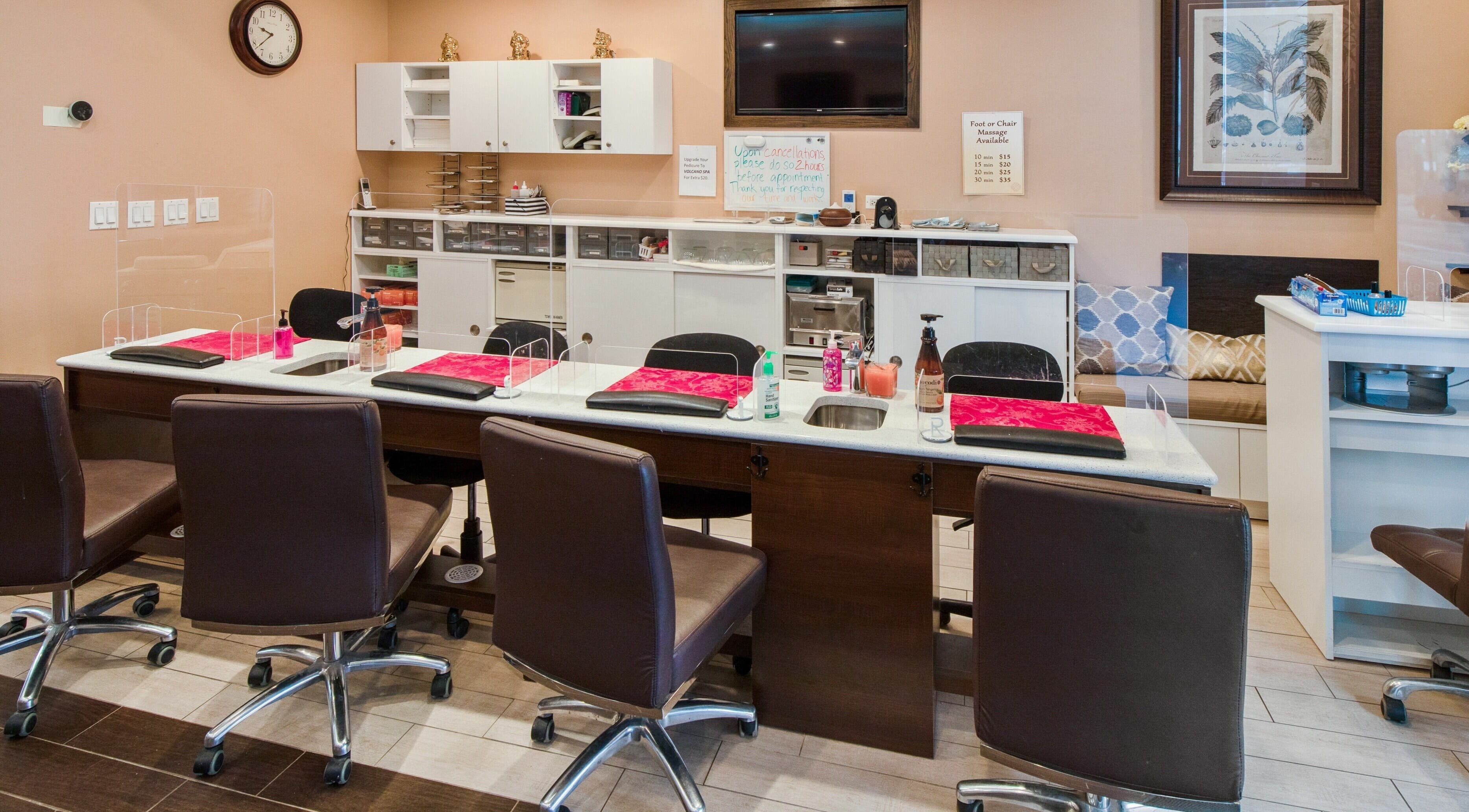 Elegant manicure setup at Ruby Nails in Chicago, Illinois, US with plush seating and modern decor.